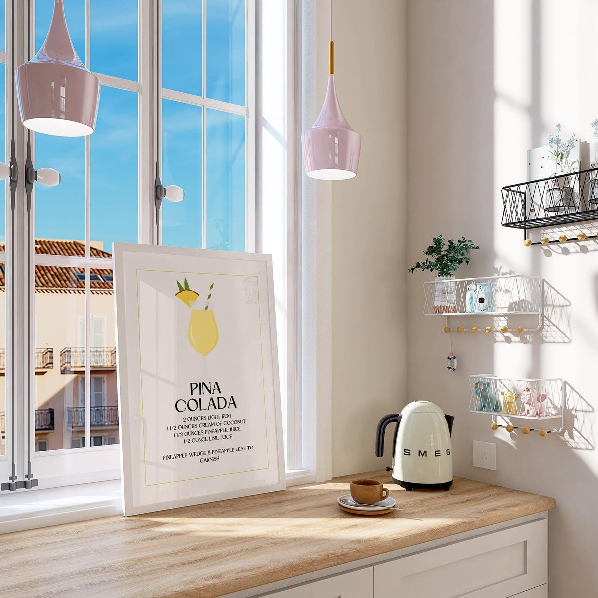 Print leaning on a kitchen window sill with a minimialist pina colada cocktail illustration and pastel tones