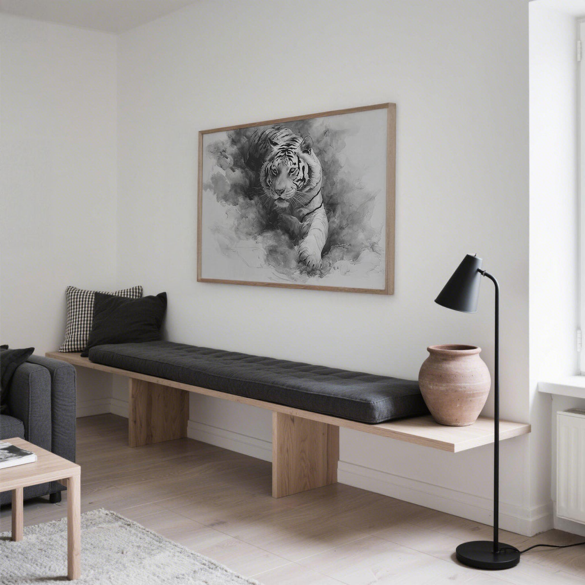 Landscape Tiger Print hung above a wooden bench with cushions in a minimalist living room