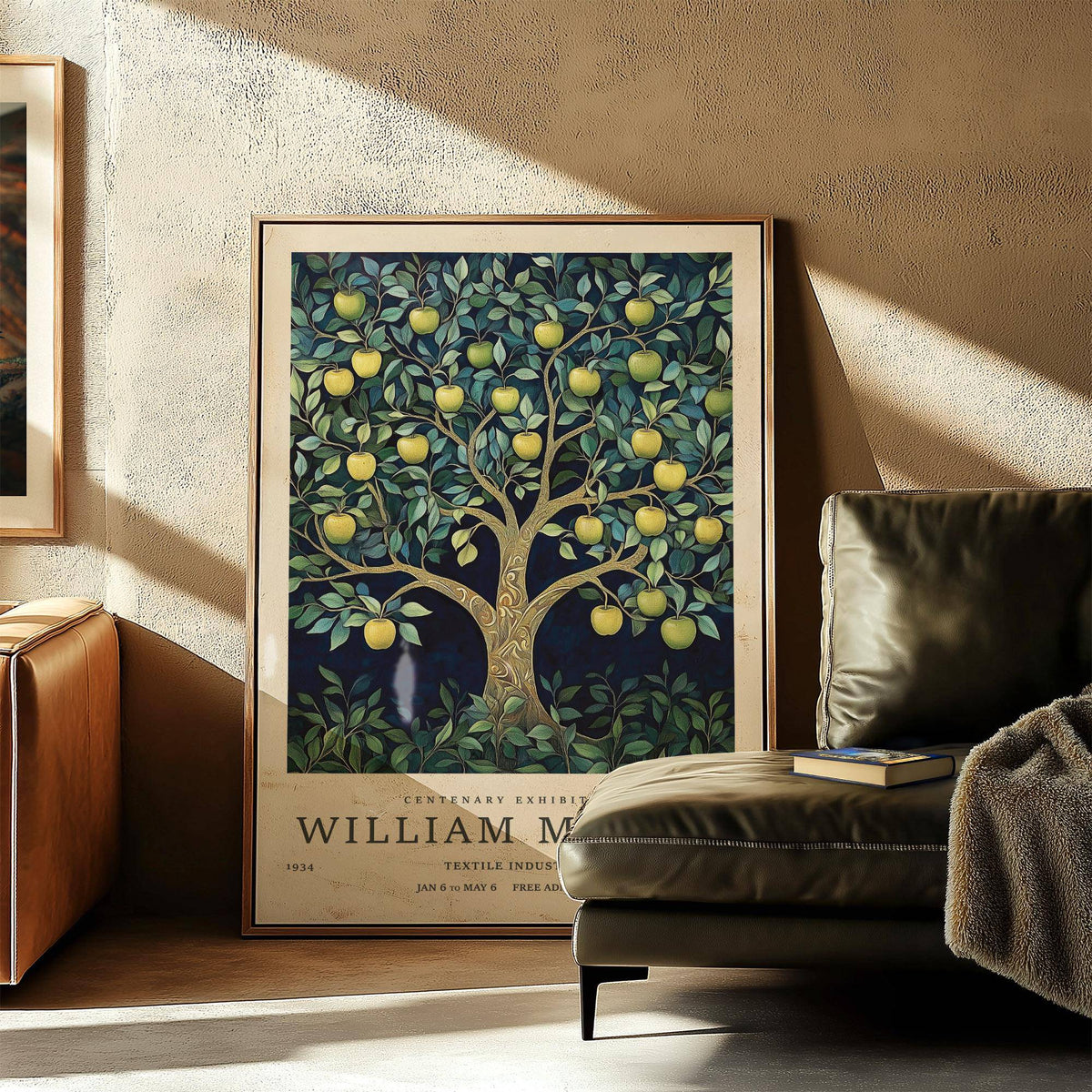 Tree art print of an apple tree with golden apples leaning on the floor beside a green leather chair