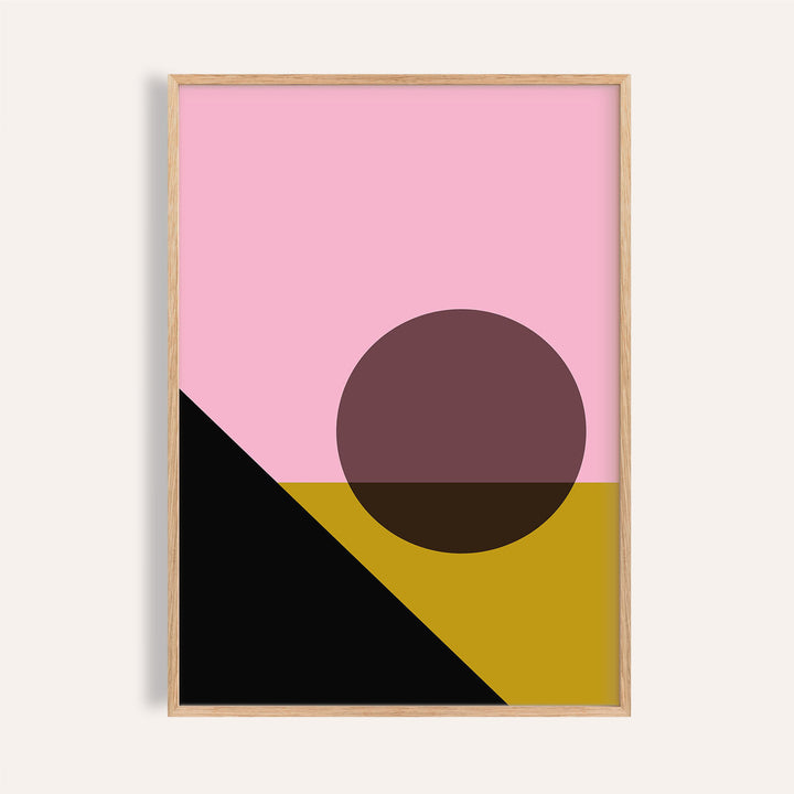 Framed print of bright colored artwork with abstract mountain and sun in pink, black and mustard colours