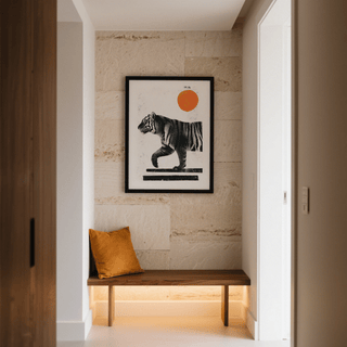 Indian Tiger Print of a minimalist walking tiger with an orange sun above a wooden bench with a brown cushion