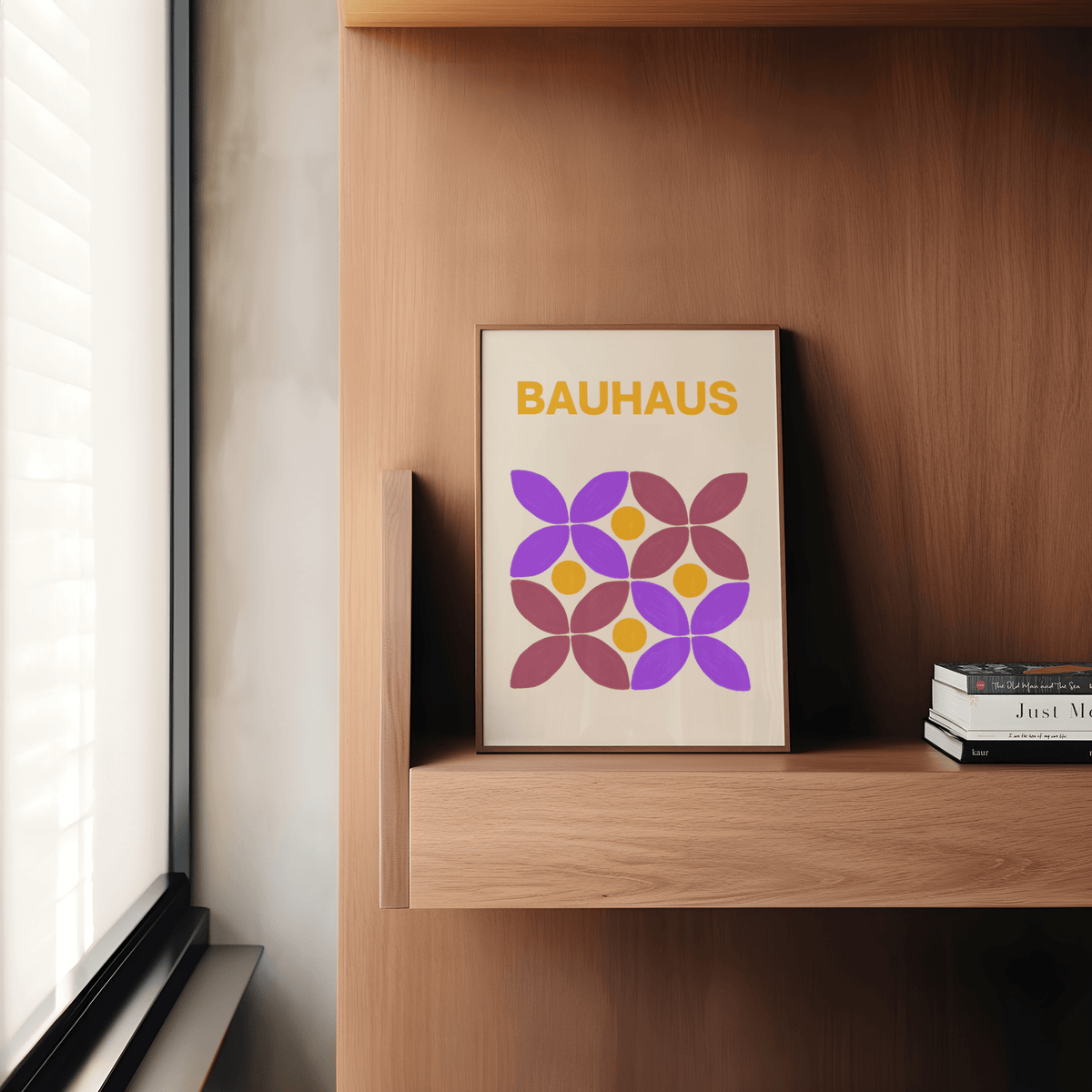 Floral Shape Art print leaning on a wooden shelf with books and yellow and purple flowers in minimalist style