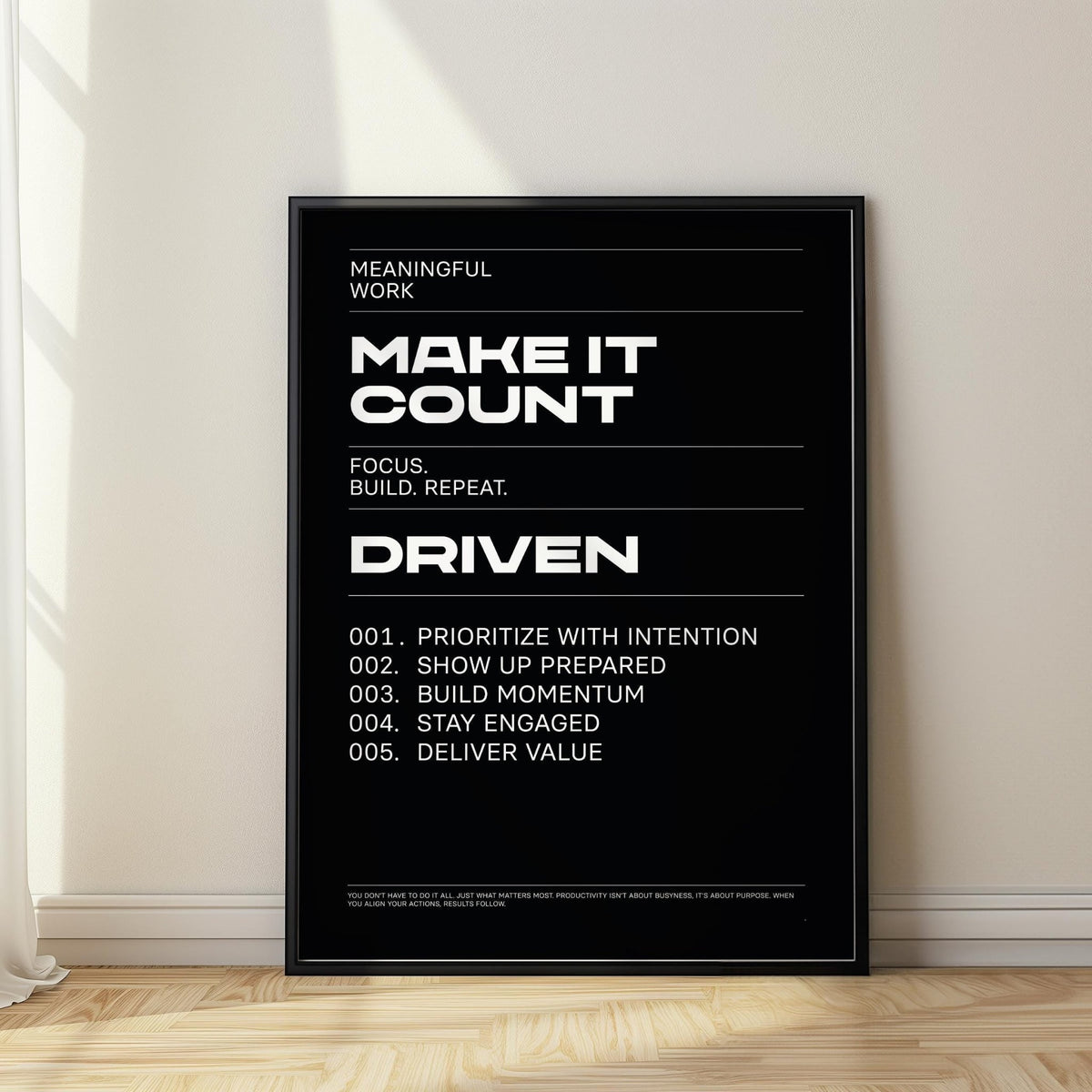Mindset wall art leaning on the floor with sunlight on minimalist black and white typographic poster