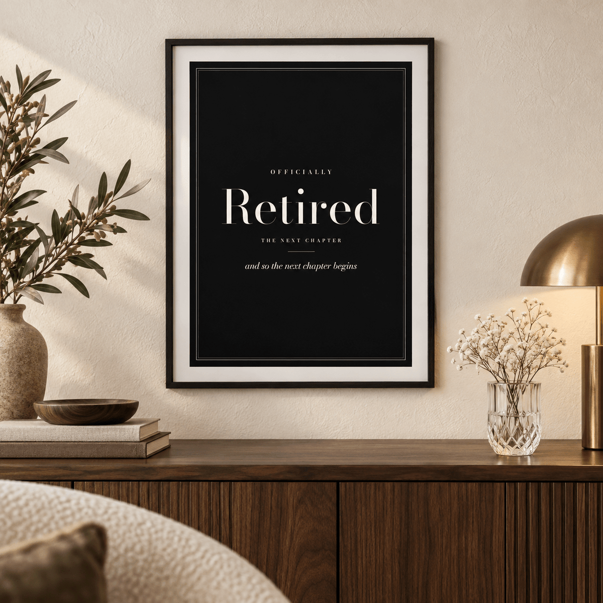 Elegant retired typography print above a wooden sideboard in a living room