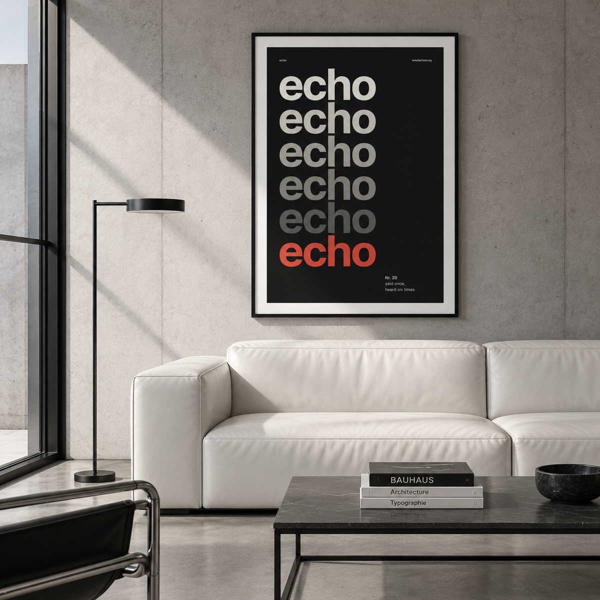 Black and cream word art print above a sofa in a living room