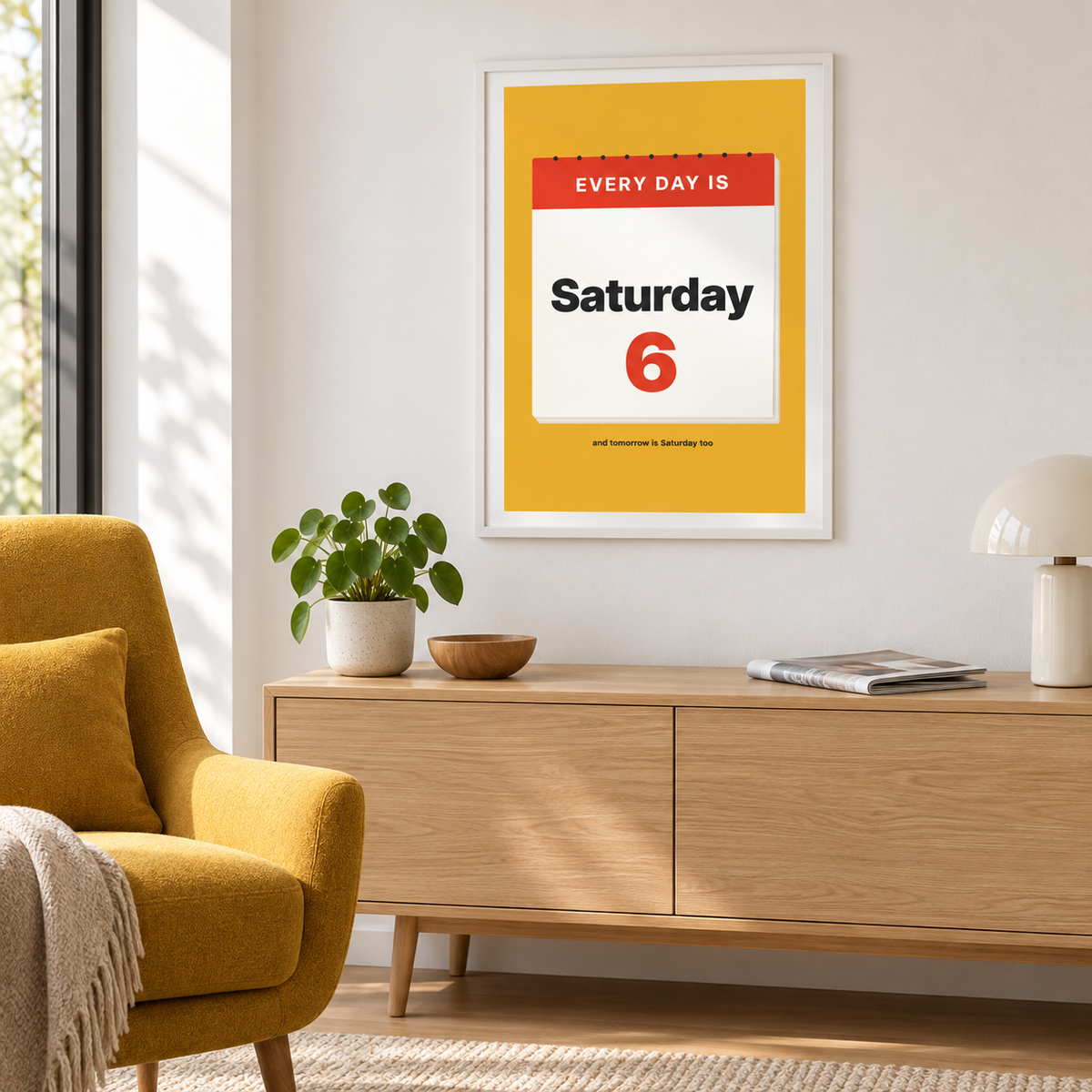 Mustard Saturday calendar print above a sofa in a relaxed living room