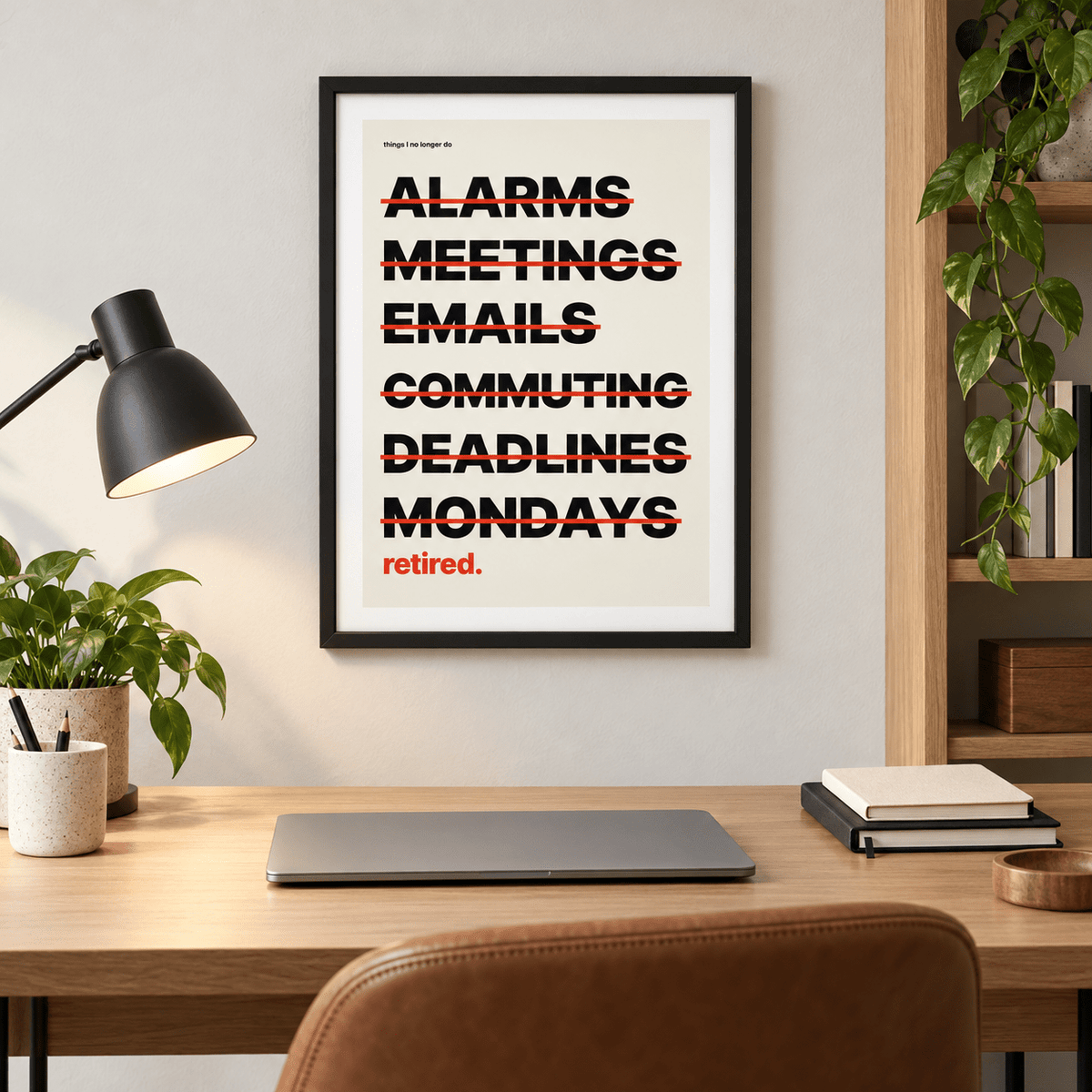 Happy retirement list print above a desk in a quiet home study