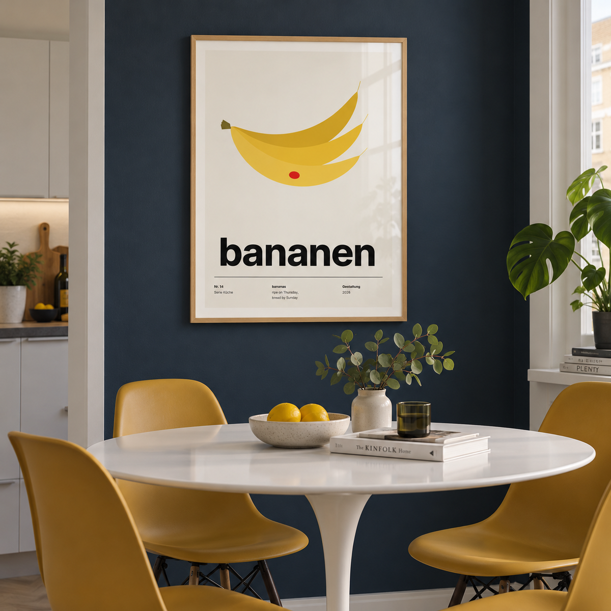 Swiss style banana typography print in a dining against an ink blue wall