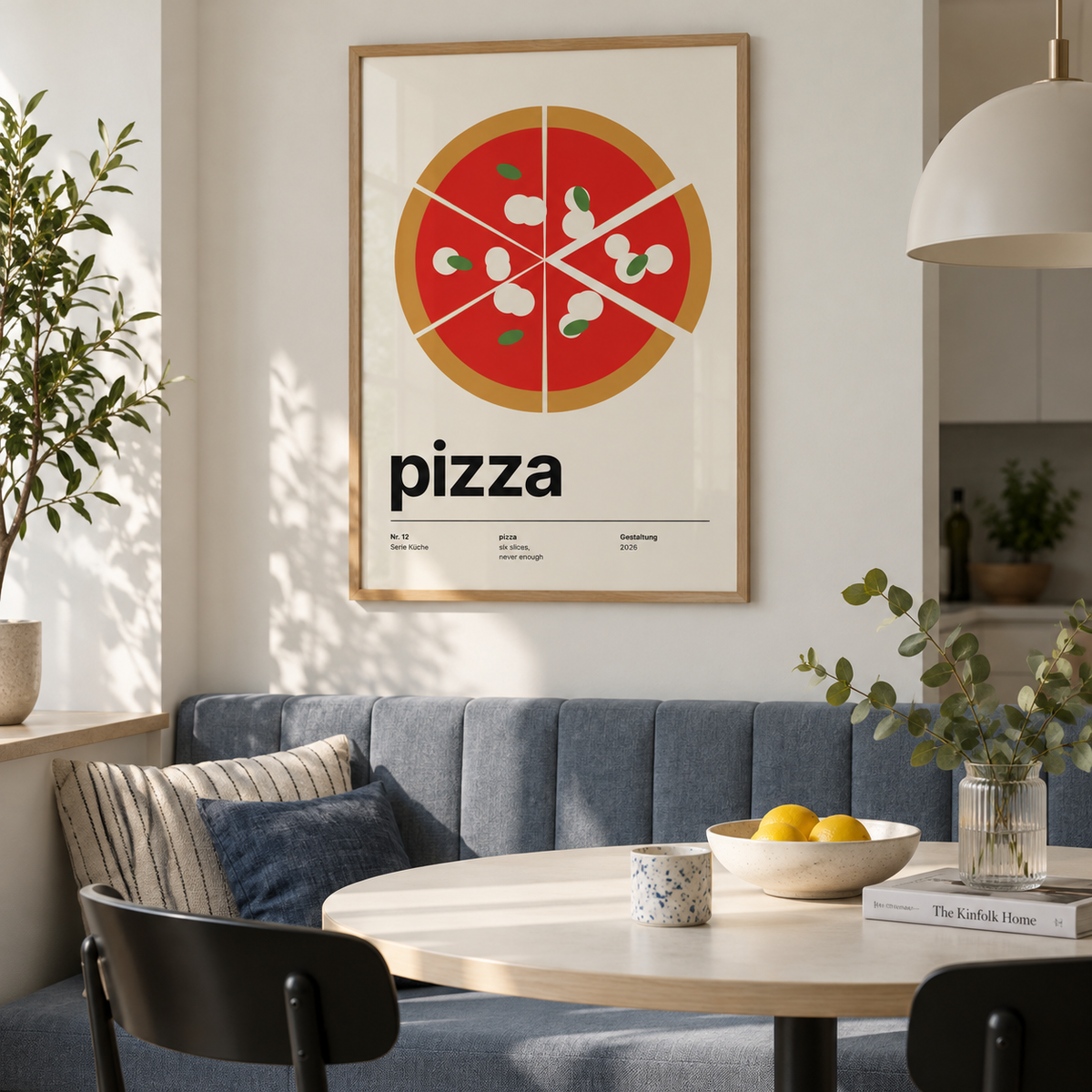 Swiss style pizza typography print above a banquette in a dining against a blue grey wall