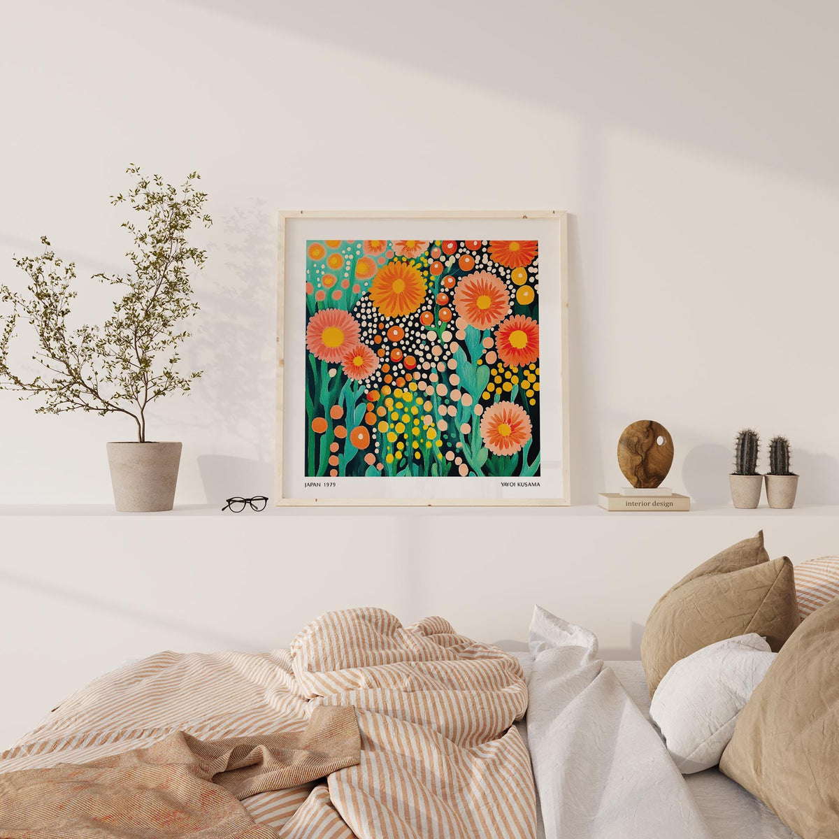 Colorful flower art print with bright orange and pink blossoms above a beige bed