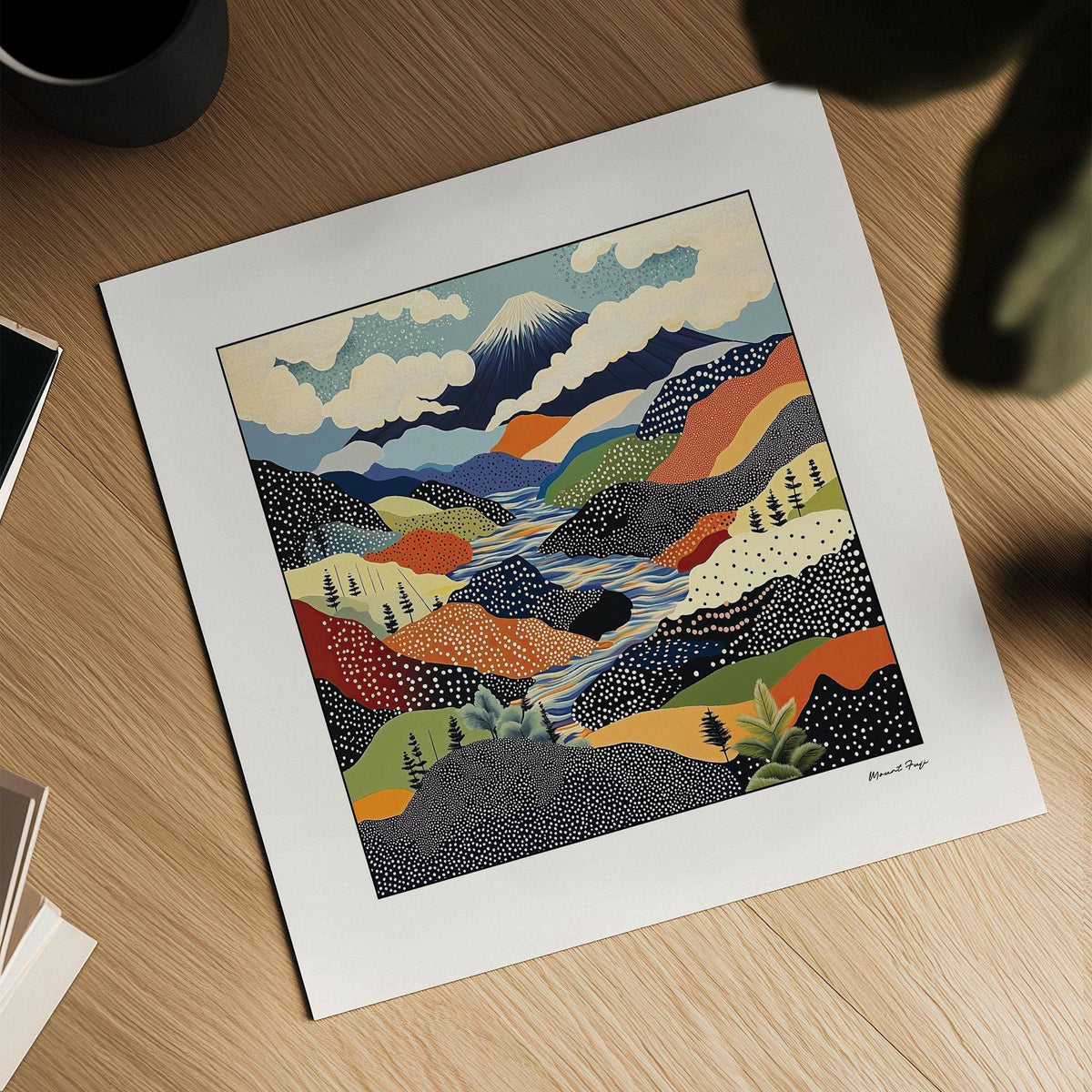 Mount Fuji Japanese art print with an abstract colourful mountain landscape lying on a wooden surface with plant shadows