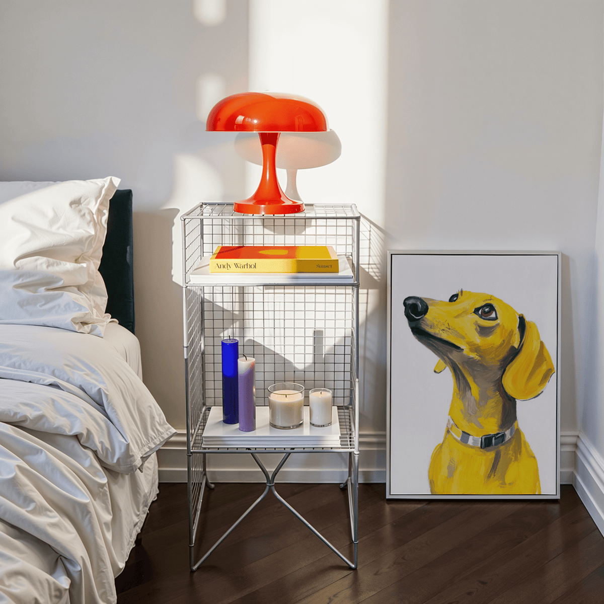 Print of a yellow dachshund dog leaning against a bedroom wall near bedside table with a red lamp