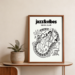 Framed jazz music wall art in black and white with a jazz band and piano keyboard beside a green plant on a wooden table