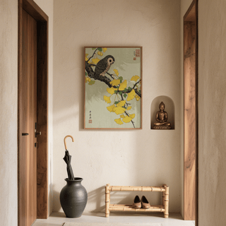 Owl and Ginkgo Print hanging above a bamboo shoe rack with a black umbrella stand and Buddha statue nearby