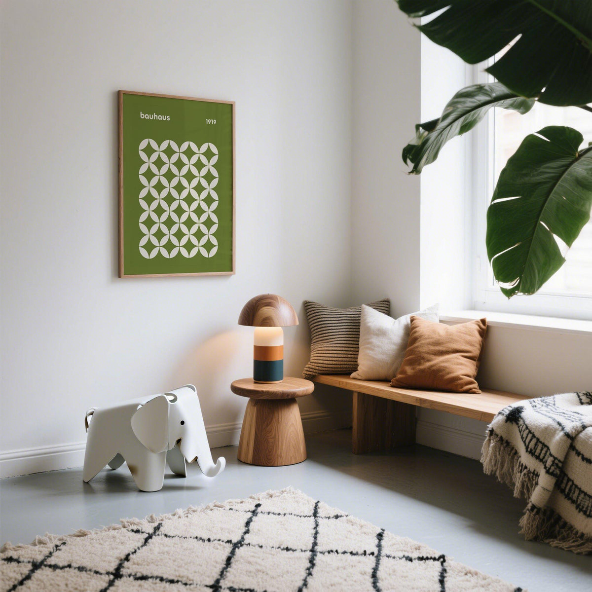 Mid Century Geometric Bauhaus print with green and cream circle petal pattern in a minimalist living room with a wooden side table