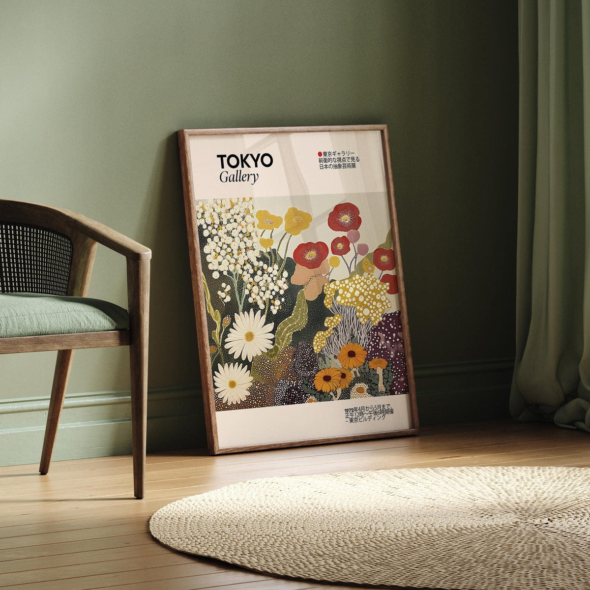 Print leaning on the floor of stylised wildflowers in warm colours beside a wooden chair