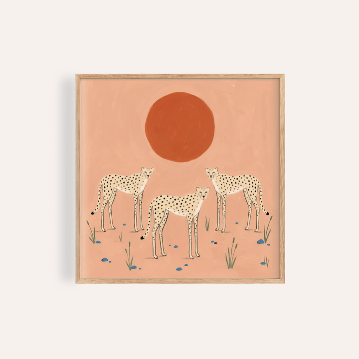 Framed close-up of cheetah art print showing three minimalist cheetahs with a red sun