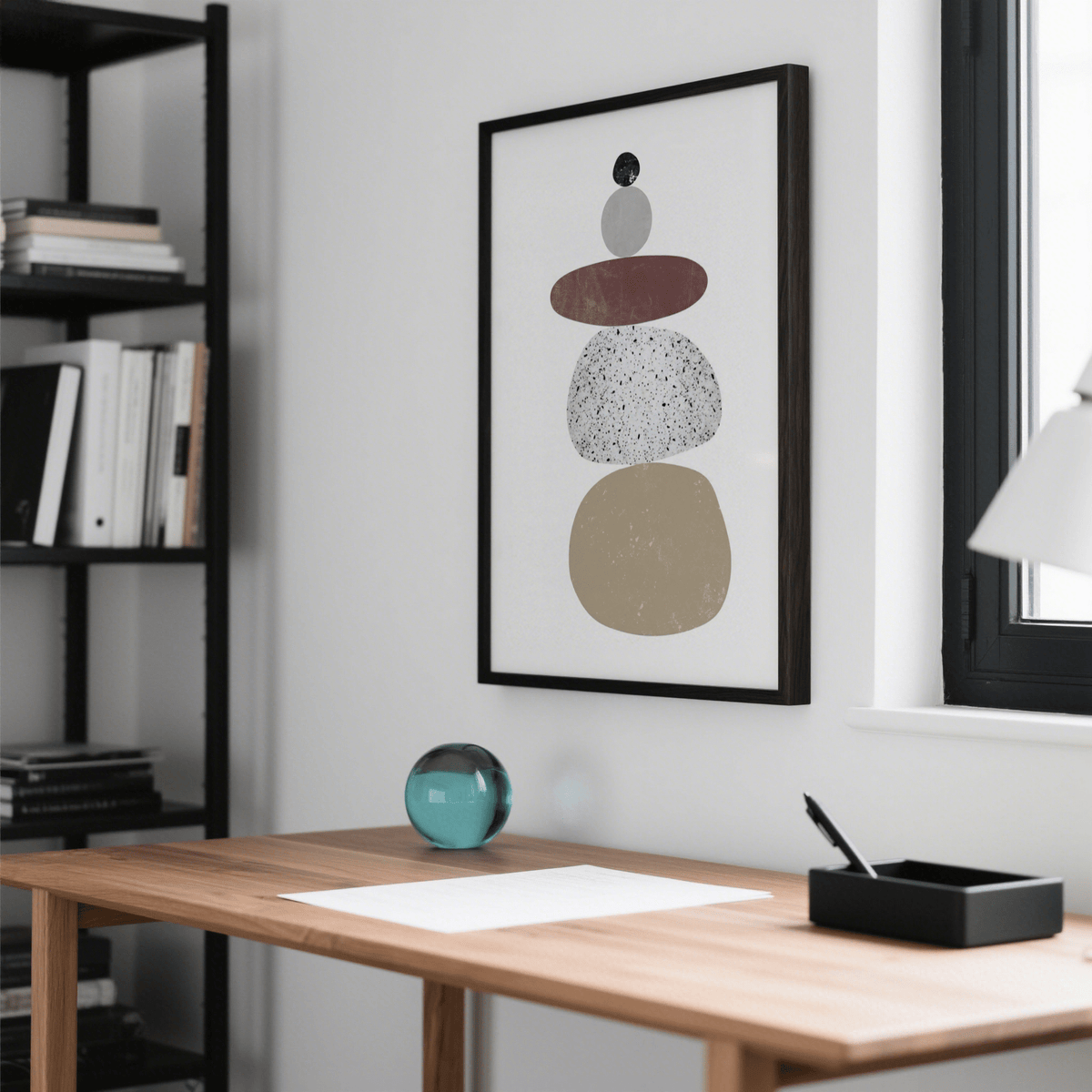 Abstract Rock Art Print in a home office with a wooden desk and a blue glass paperweight