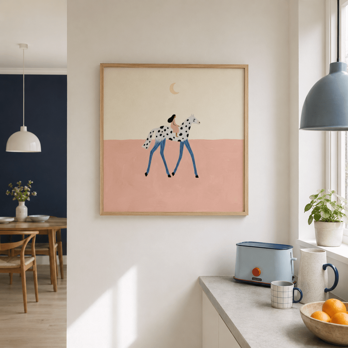 Fantasy Horse Art Print hanging on a white wall in a kitchen with a blue toaster and a bowl of oranges