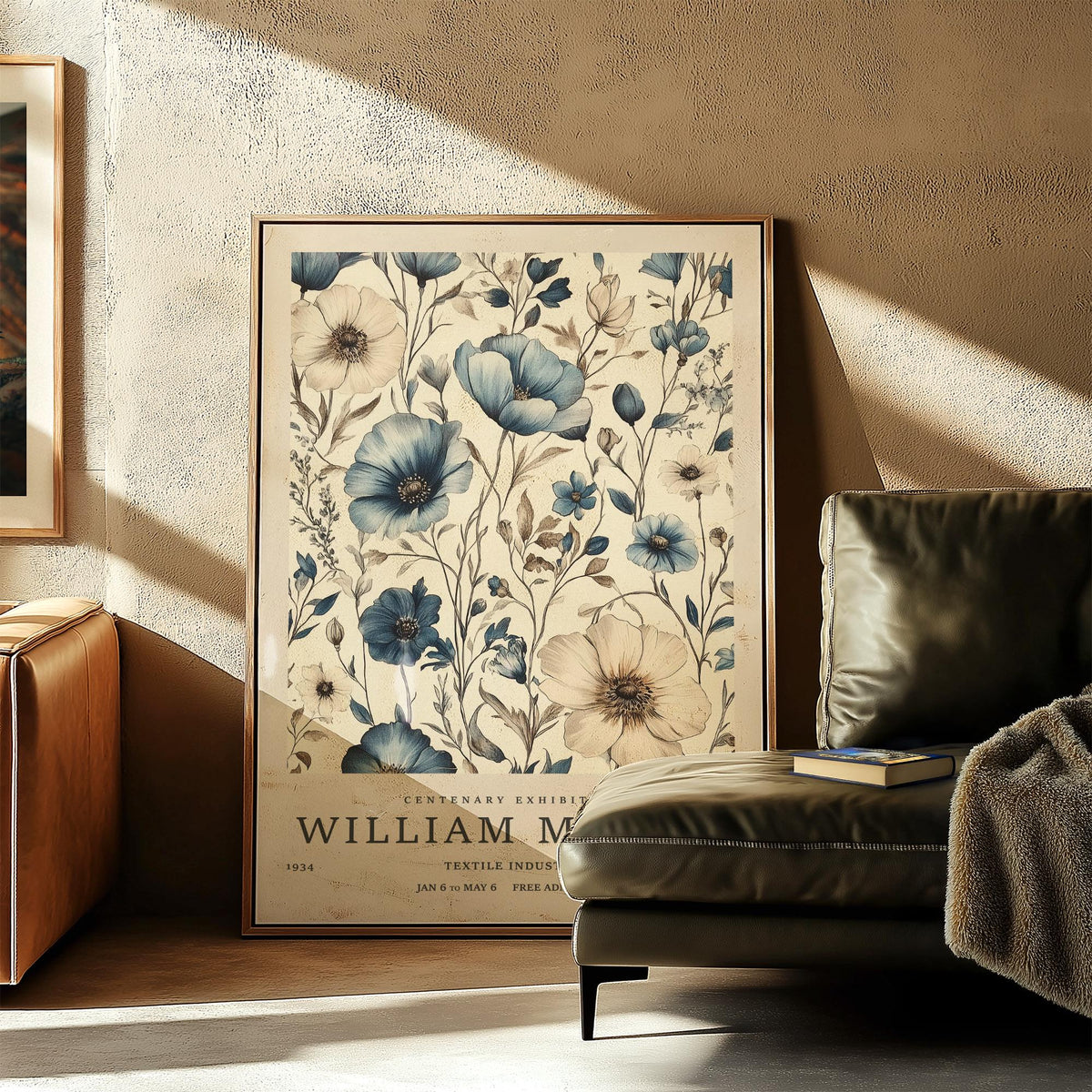 Print leaning on floor featuring blue and ivory flowers with William Morris text beside a sofa