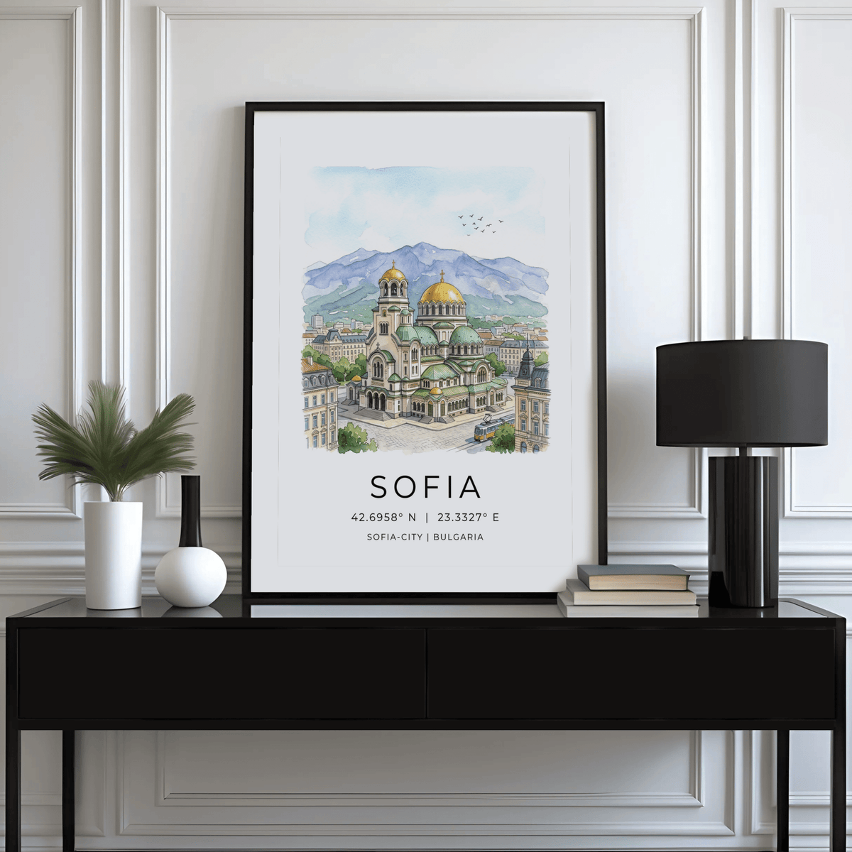Sofia City Art Print framed with a plant and lamp on a black table in a white room