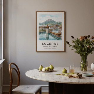 Print on a wall of a Lucerne watercolor art print above a dining table with pears and a flower vase