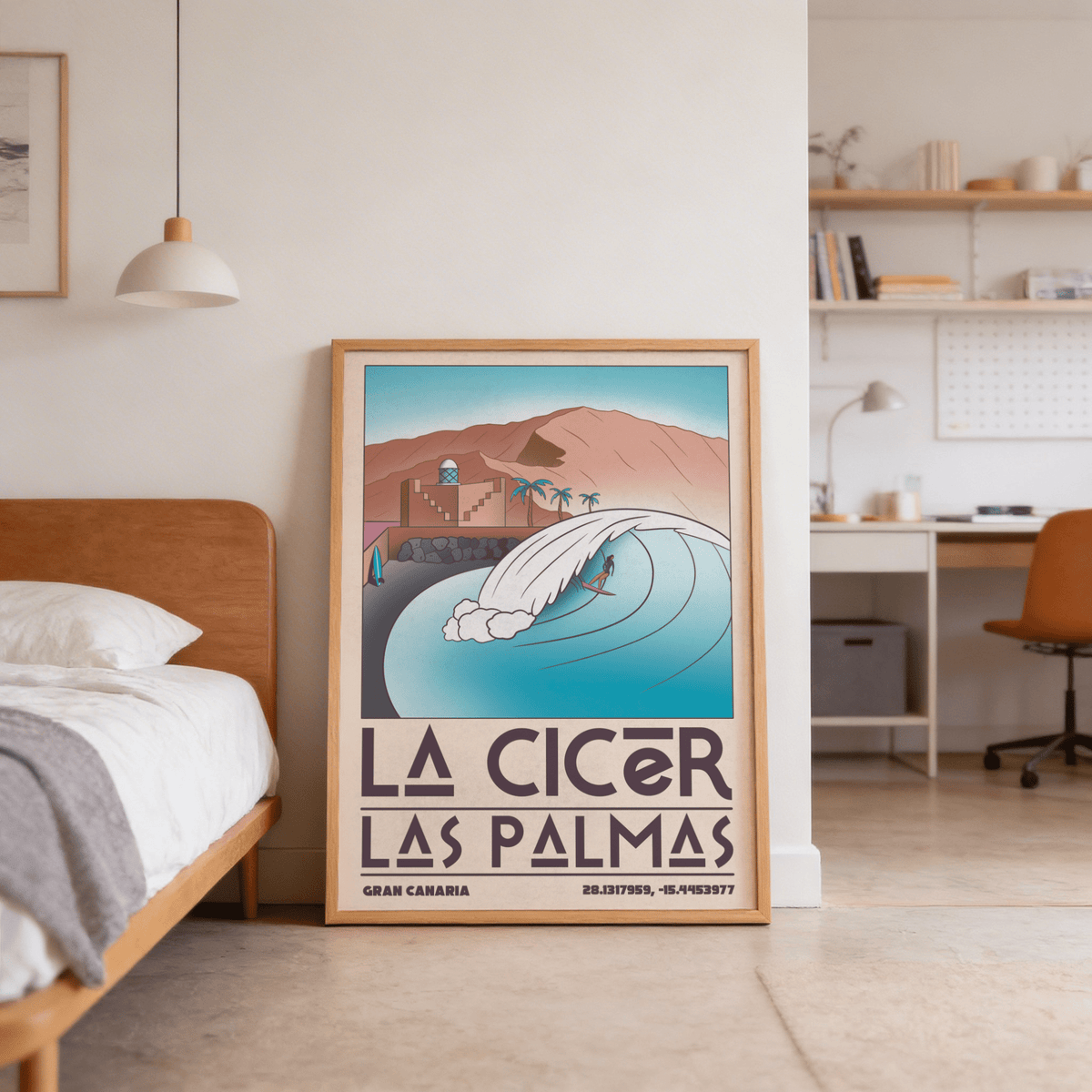 Las Palmas wall art leaning on a floor by a bed illustrating a surfer on a wave in blue and brown tones