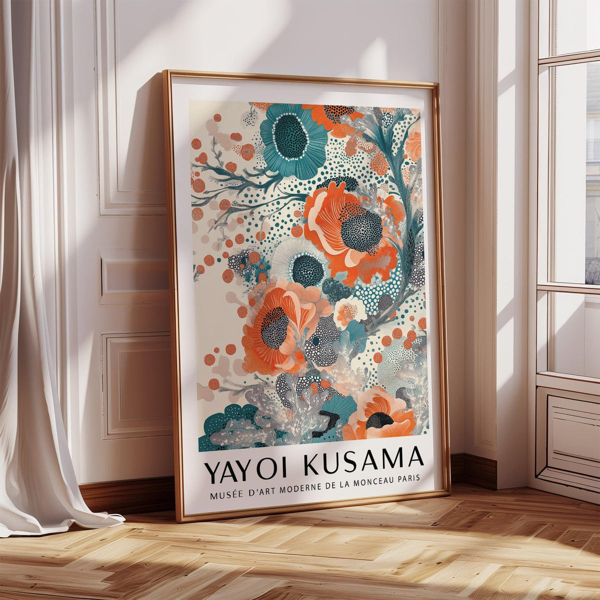 Print leaning on floor showing abstract floral blooms in teal and orange near a large window