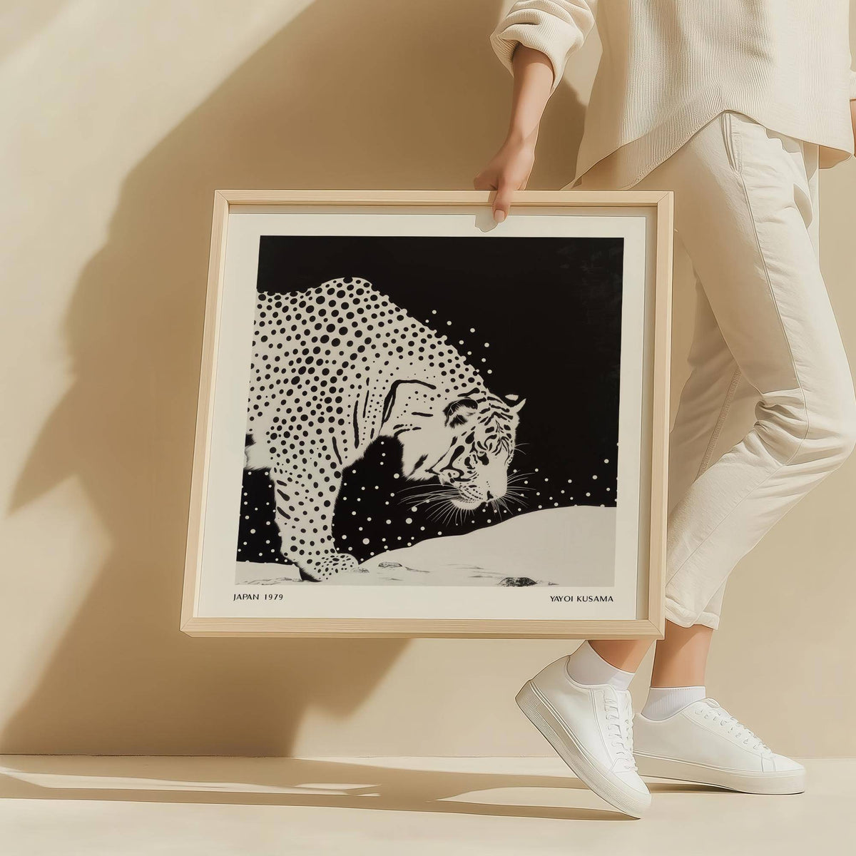 Framed Japanese Tiger Art print featuring a spotted tiger in black and white held by person in white clothing