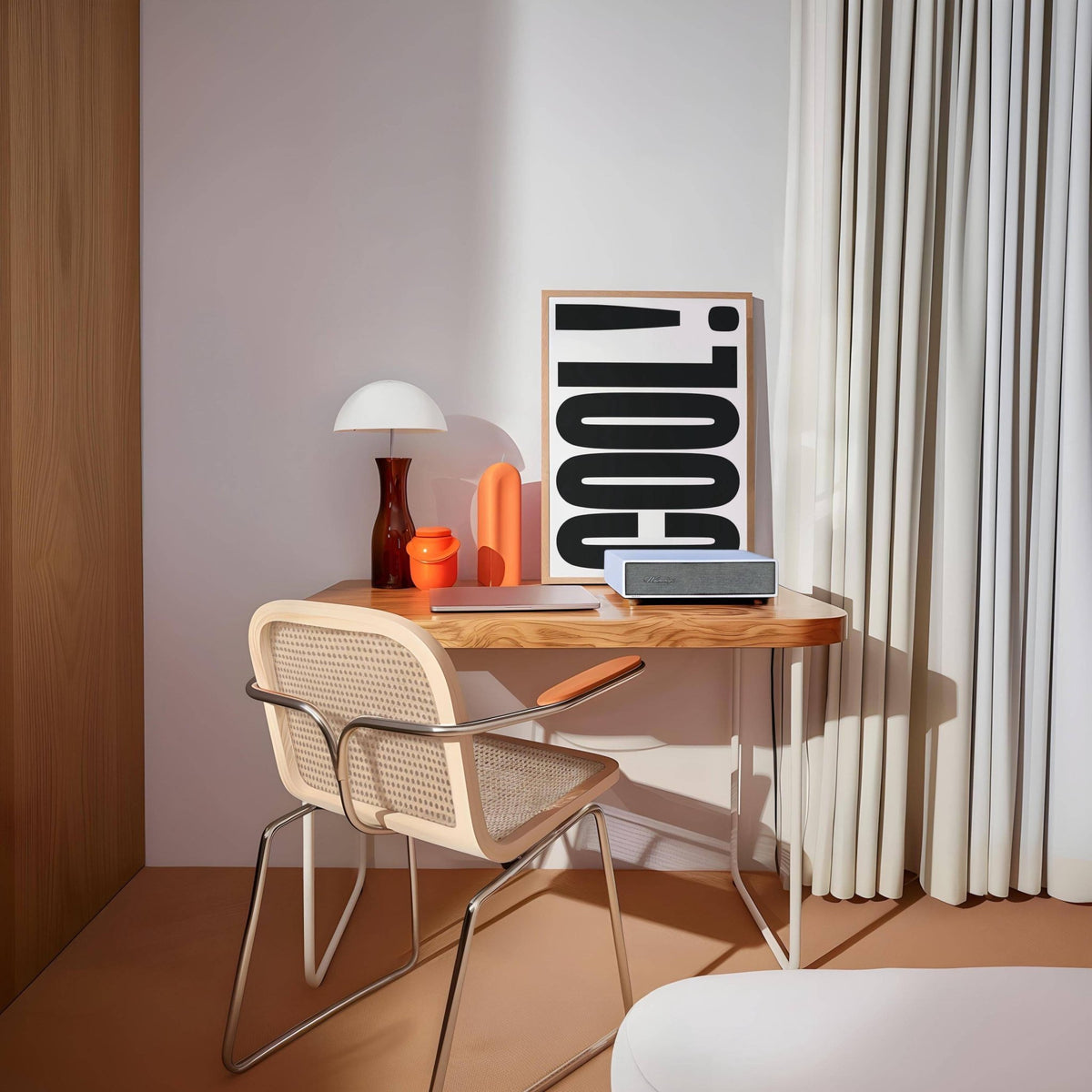 Print on a desk of the Cool Typography Poster with black text in a room with wooden furniture