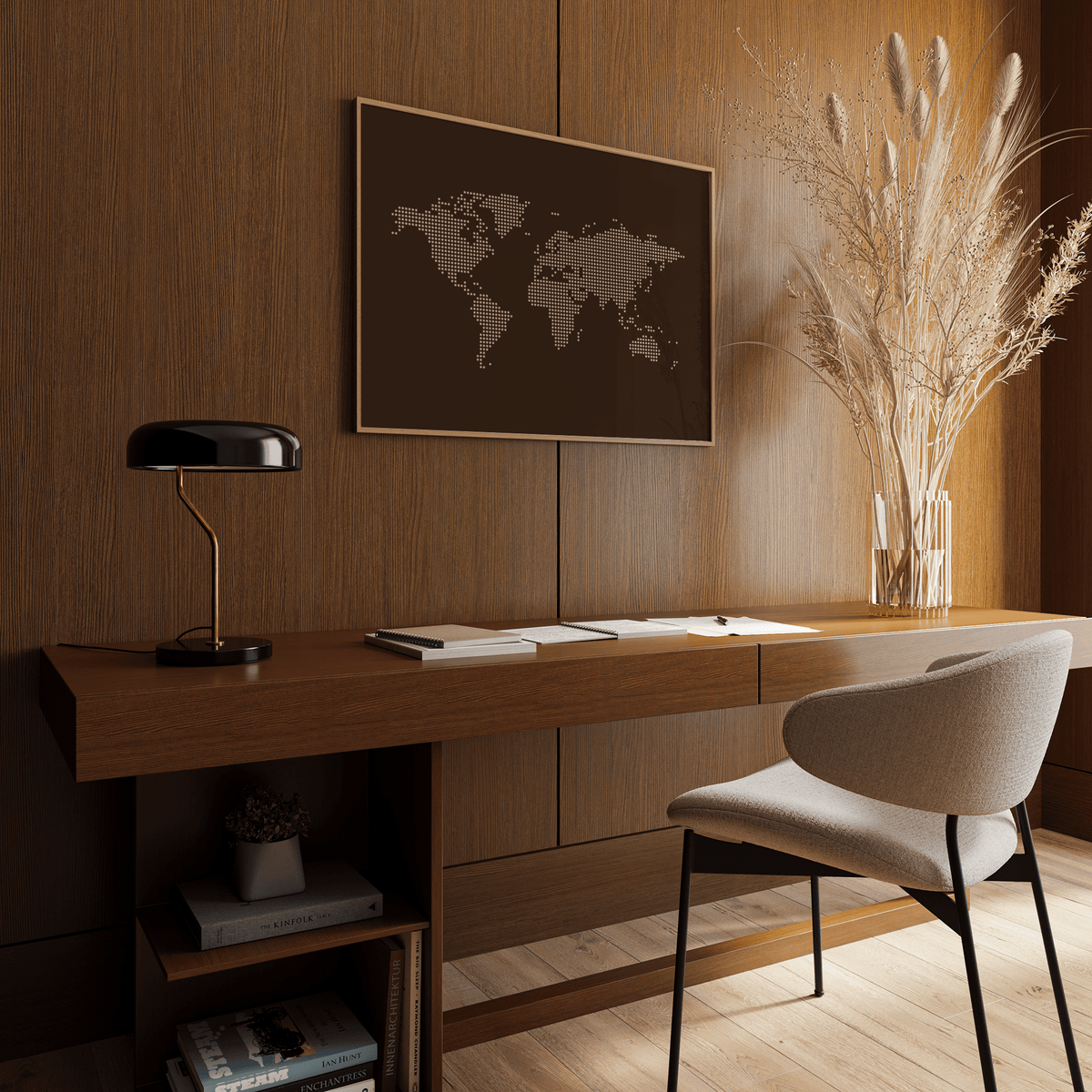 World Map Poster in a minimalist brown and beige colour scheme above a wooden desk with a black lamp and decorative plant