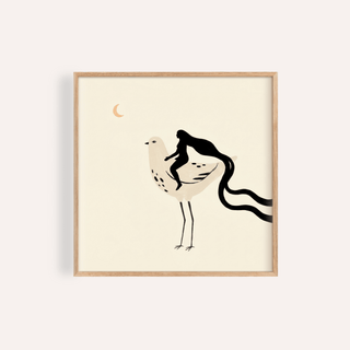 Framed print close-up of whimsical bird art print with a woman riding a bird and a muted cream background