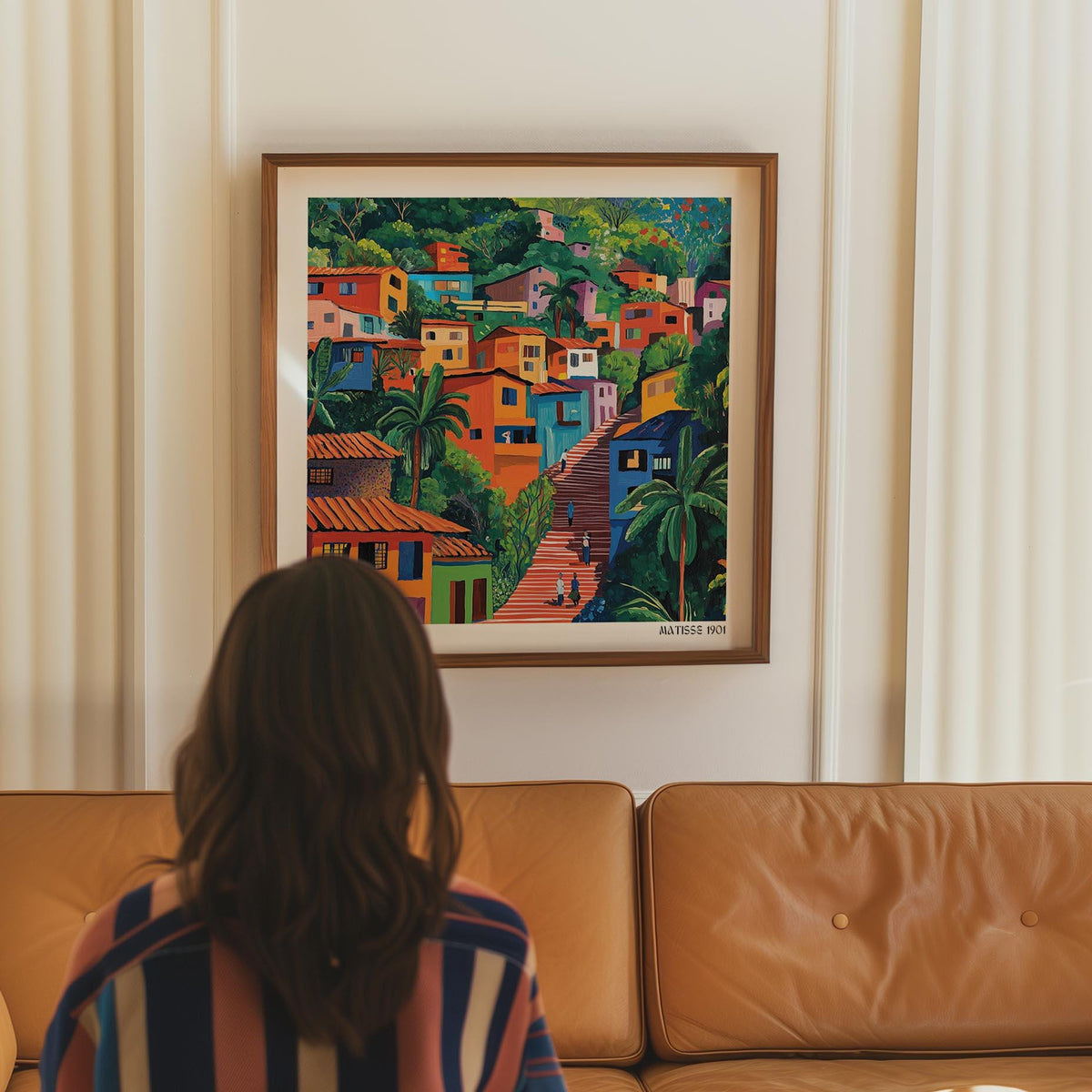 Comuna 13 Art framed print of colourful hillside houses above a brown leather sofa and cream curtains