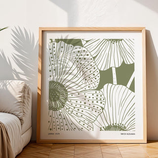 Framed Sage Green Abstract Wall Art of stylised poppy flowers with shadow on floor beside sofa