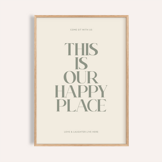 Framed print close-up with typography saying This Is Our Happy Place in muted green on cream background