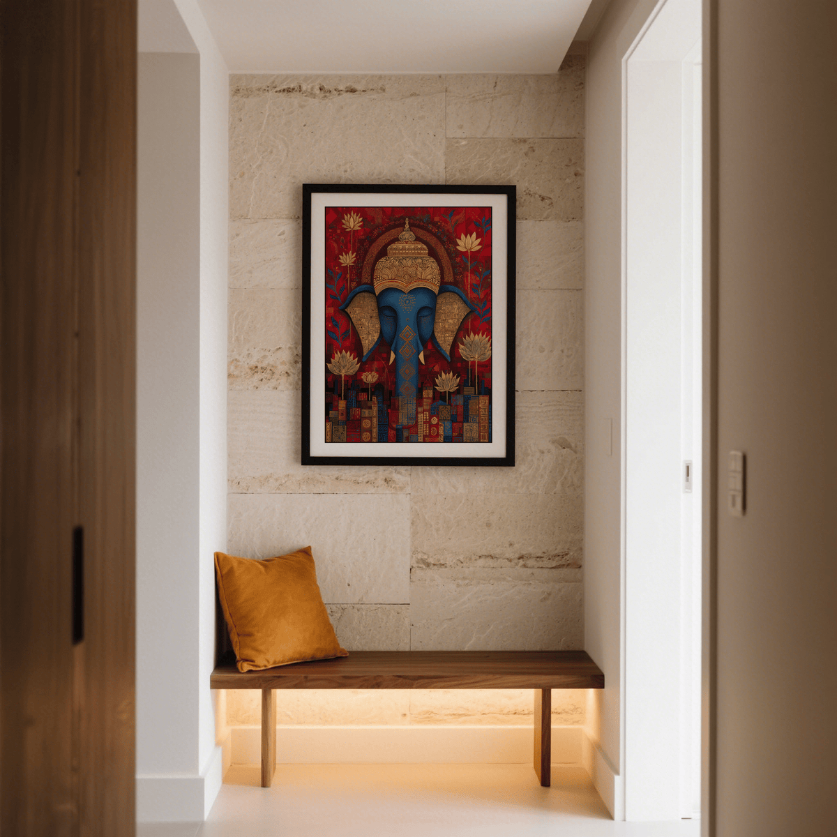 Vibrant Buddha wall art of an elephant head with gold and blue tones hanging above a wooden bench with a rust cushion