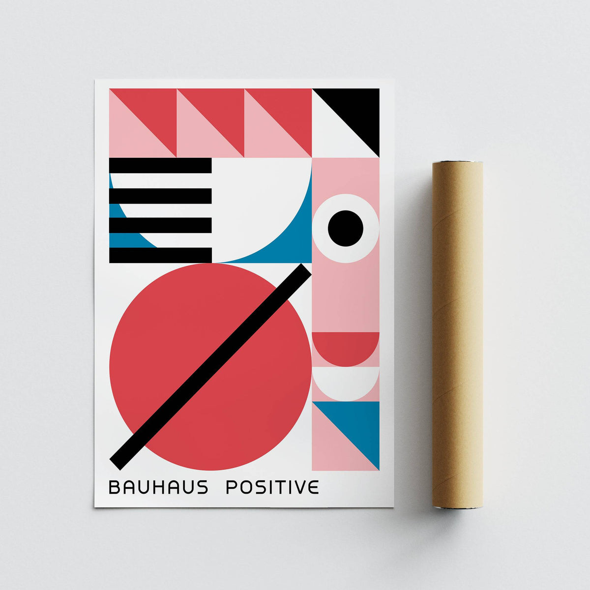 Colorful Geometric Art flat print with red, pink and blue shapes alongside a packing tube