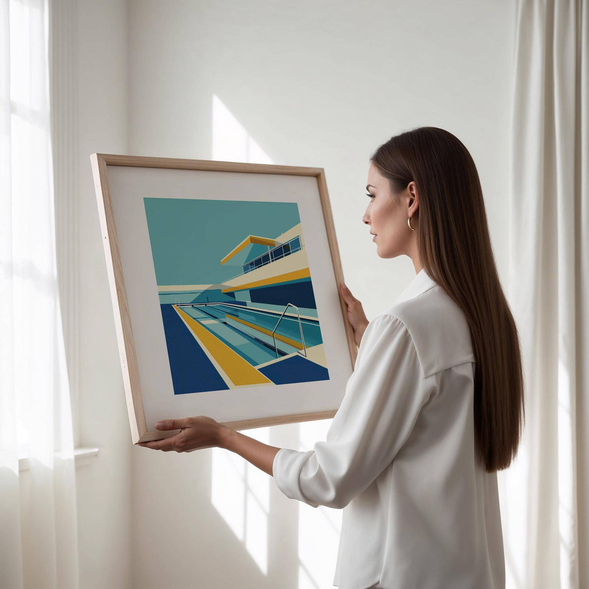 Framed Poolside Art held by a woman with white blouse and natural light through window
