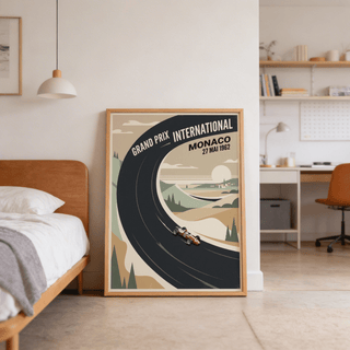 Print leaning on a floor of a vintage car racing poster with a black curved race track and beige landscape