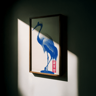 Crane Wall Art framed print close-up with blue crane and red script in side light