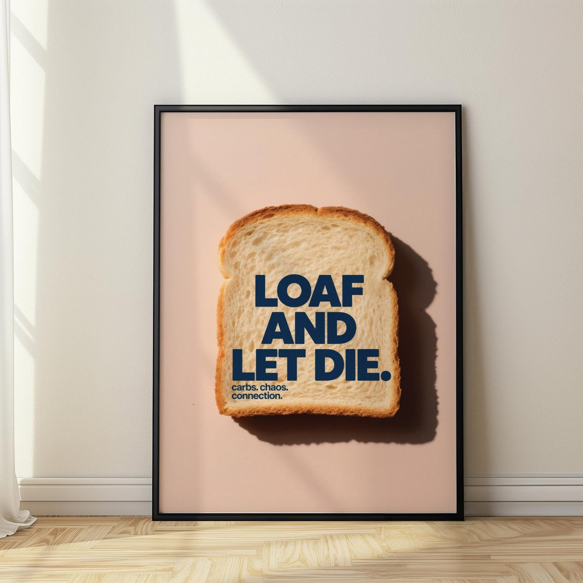 Framed print close-up of quirky kitchen art showing a slice of white bread with dark blue text