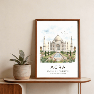 Framed Agra Historical Poster of the Taj Mahal watercolour illustration beside a green plant on a table