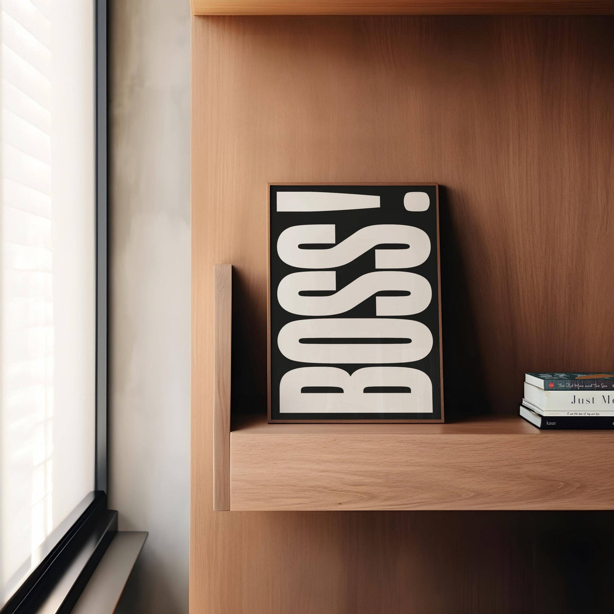 Gift for Boss print leaning on a wooden shelf with a few books nearby in soft natural light