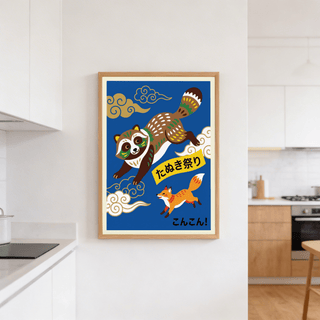 Japanese Animal Art Print on a white kitchen wall featuring a dancing raccoon and a fox on blue background