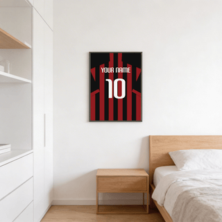 Football Shirt Poster in Red and Black Stripes on bedroom wall above wooden bedside table with white bedding