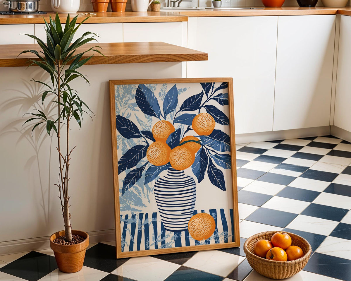 Orange Blue wall art leaning on a kitchen floor with black and white tiles and a plant nearby