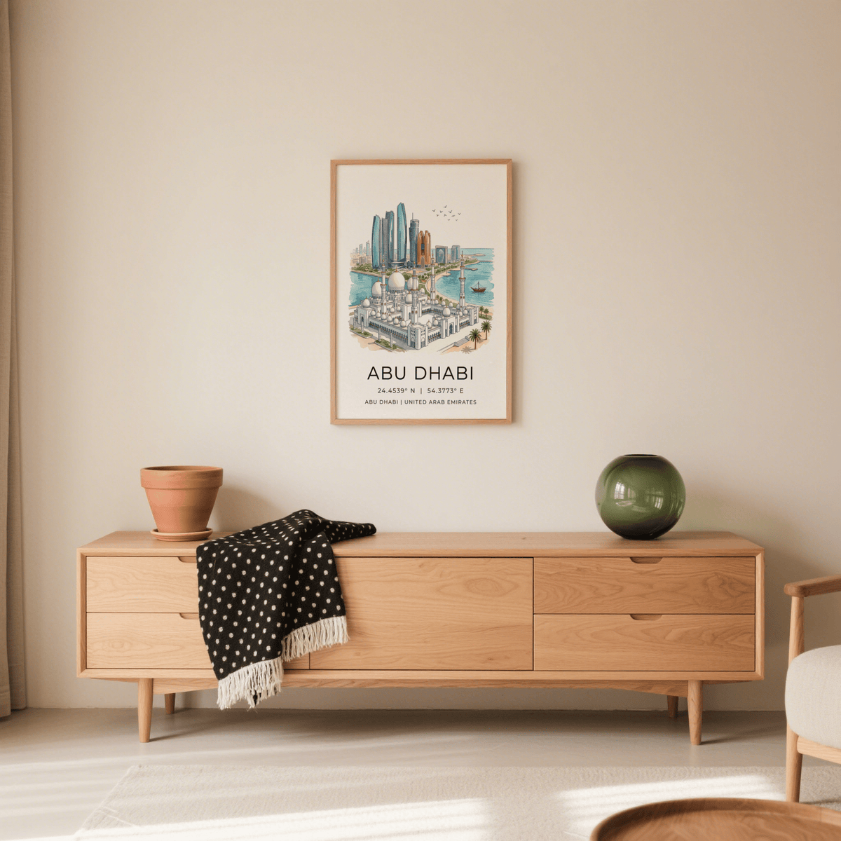 Abu Dhabi art print of an illustrated skyline in watercolour hanging above a wooden sideboard with a green vase