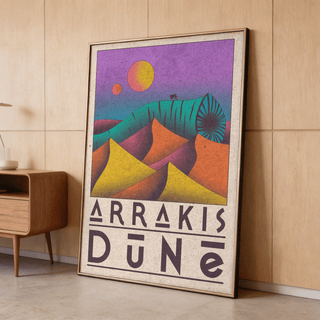 Print leaning on floor of Desert Dunes sci-fi poster with purple sky and yellow orange dunes near wooden mid-century cabinet