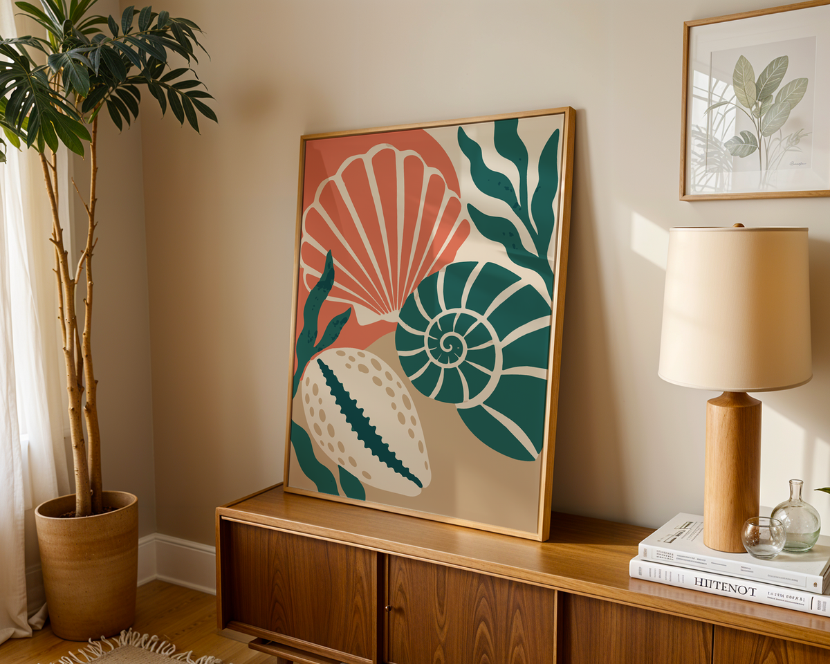 Seashell wall art on warm sand leaning on a wooden sideboard in a warm living room