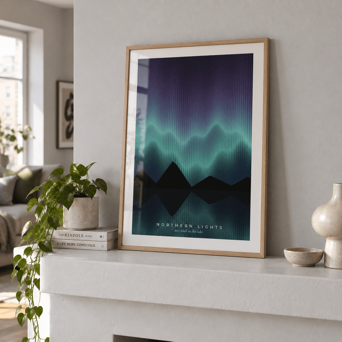 Aurora mirrored in a lake print beside a bed against a midnight blue wall